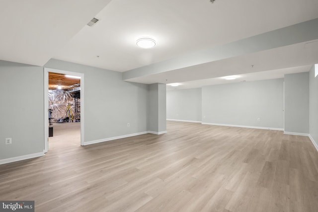 basement featuring light hardwood / wood-style flooring
