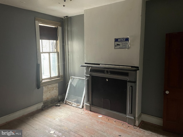 unfurnished living room with light hardwood / wood-style flooring