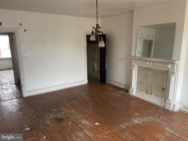 unfurnished dining area featuring hardwood / wood-style floors