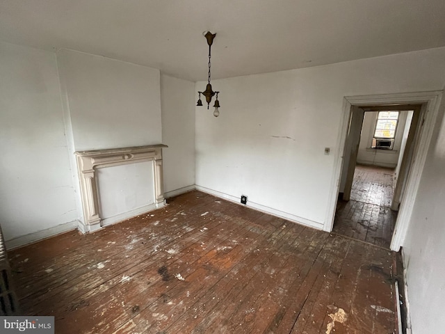 unfurnished dining area with cooling unit and dark hardwood / wood-style floors