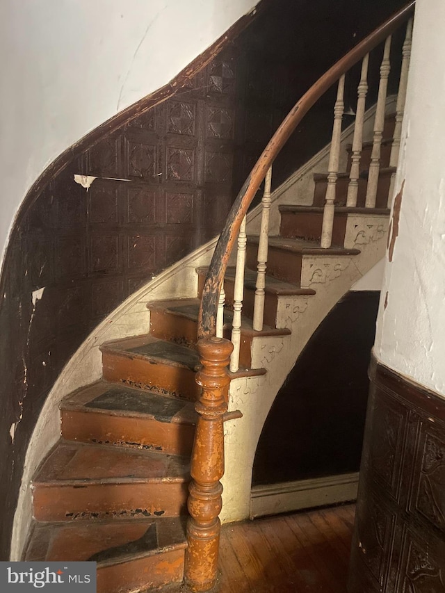 stairway with wood-type flooring