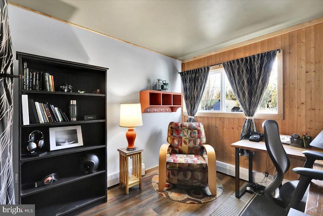 home office with wooden walls and wood finished floors