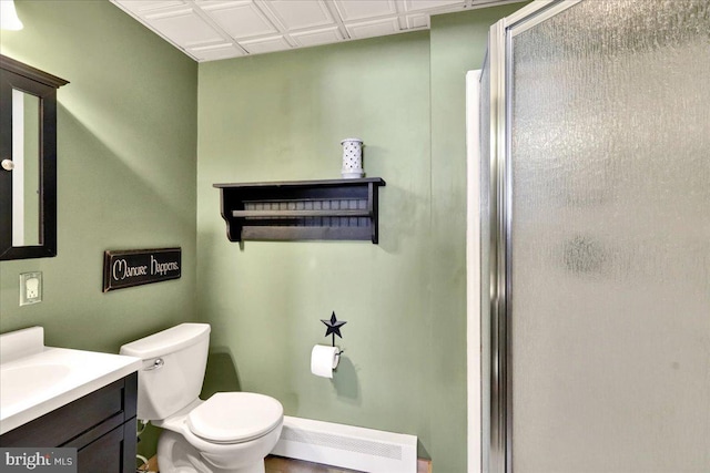 full bathroom featuring toilet, a stall shower, and vanity