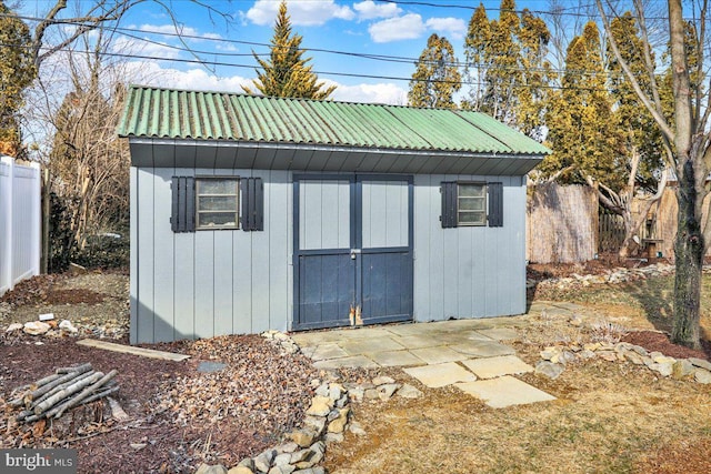 view of shed with fence