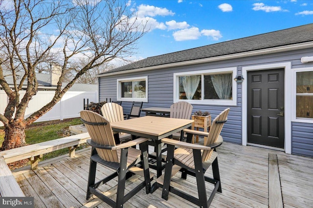 wooden deck featuring fence and outdoor dining area