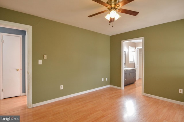 unfurnished room with ceiling fan and light hardwood / wood-style floors