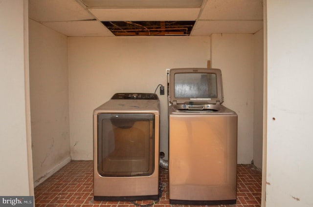 washroom featuring washer and clothes dryer