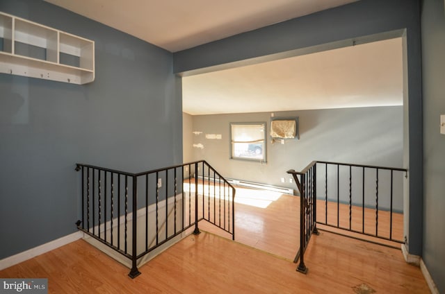 staircase with wood-type flooring