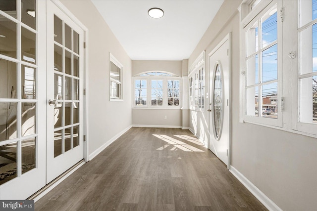 unfurnished sunroom featuring french doors