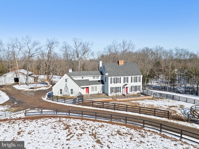 view of snow covered property