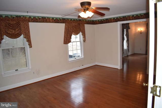 spare room featuring wood-type flooring, ornamental molding, and ceiling fan