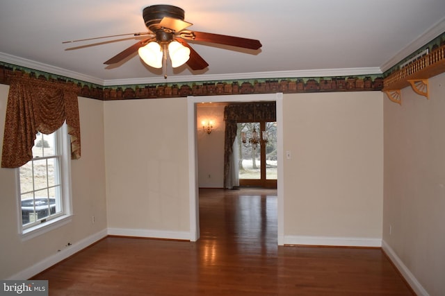 spare room with crown molding, dark hardwood / wood-style floors, and ceiling fan