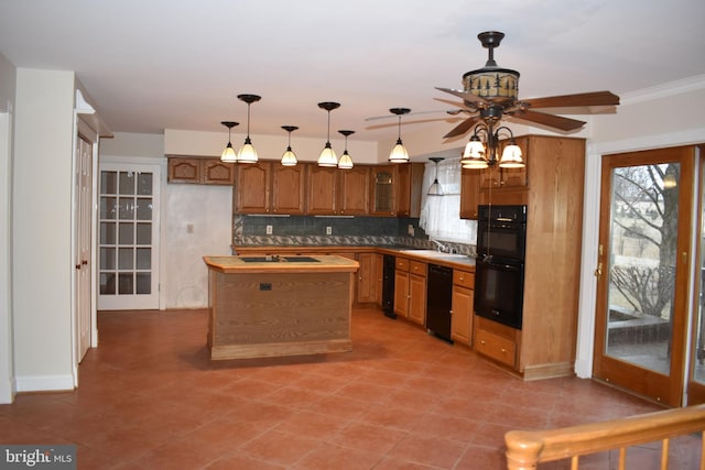 kitchen featuring sink, ceiling fan, tasteful backsplash, black appliances, and a kitchen island