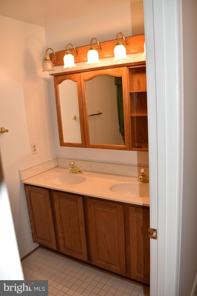 bathroom featuring tile patterned floors and vanity