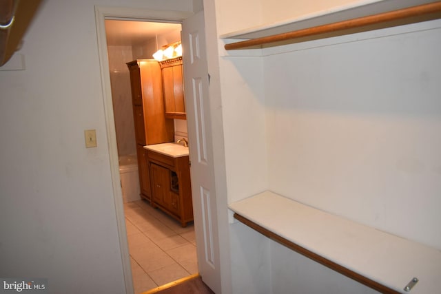 interior space with vanity and tile patterned floors