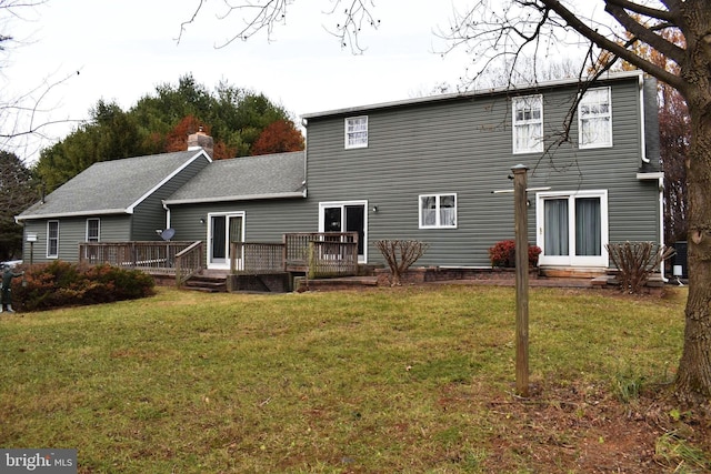 back of house with a wooden deck, a yard, and central AC unit