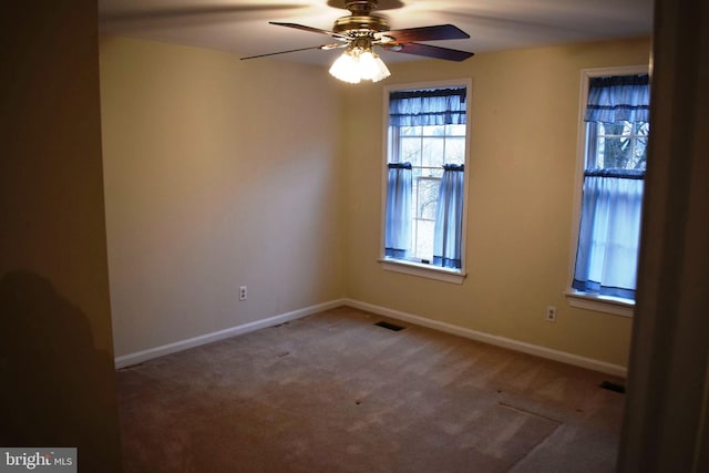 unfurnished room with carpet and ceiling fan