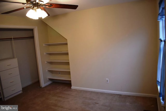 unfurnished bedroom featuring carpet flooring, ceiling fan, and a closet