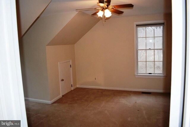 bonus room featuring vaulted ceiling, ceiling fan, and carpet