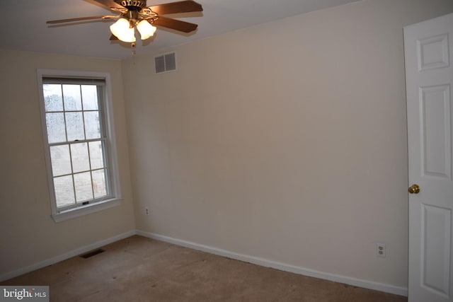 empty room with ceiling fan and carpet flooring