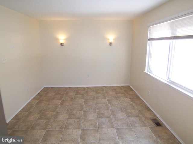 view of tiled spare room