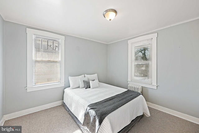 bedroom featuring crown molding, carpet flooring, and radiator