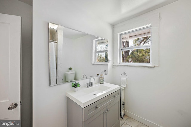 bathroom featuring vanity, toilet, and tile patterned floors