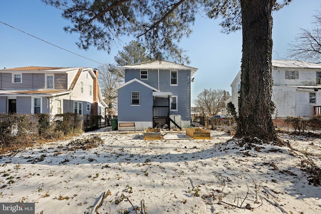 view of snow covered house