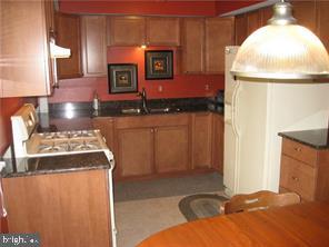 kitchen with white gas range oven and sink