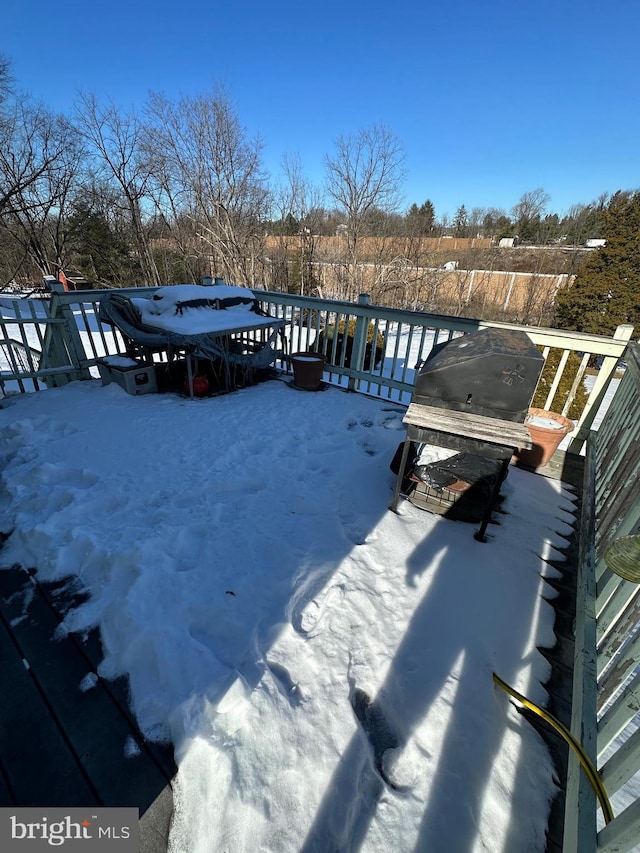 view of snow covered deck