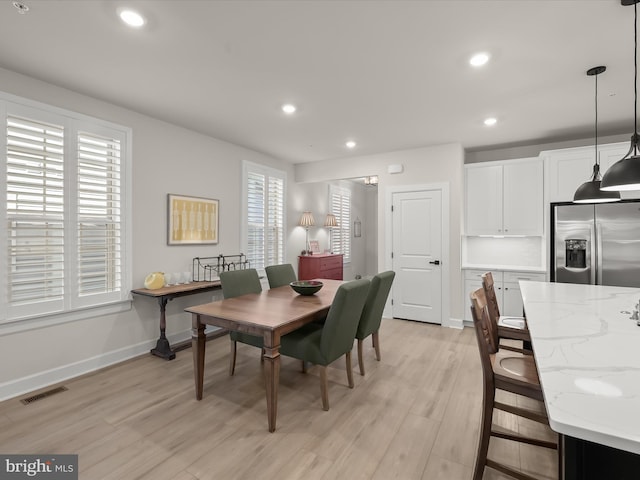 dining room with light hardwood / wood-style flooring