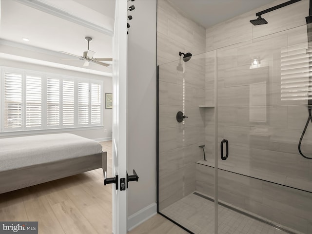 bathroom with an enclosed shower and hardwood / wood-style flooring