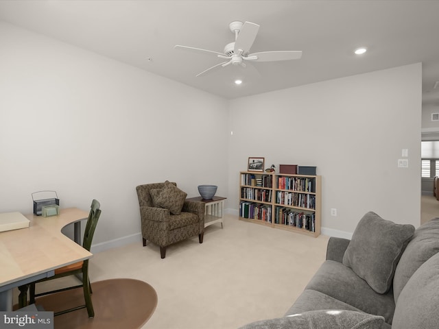 home office featuring light colored carpet and ceiling fan