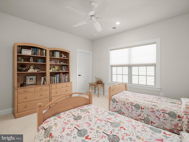 bedroom featuring light colored carpet and ceiling fan