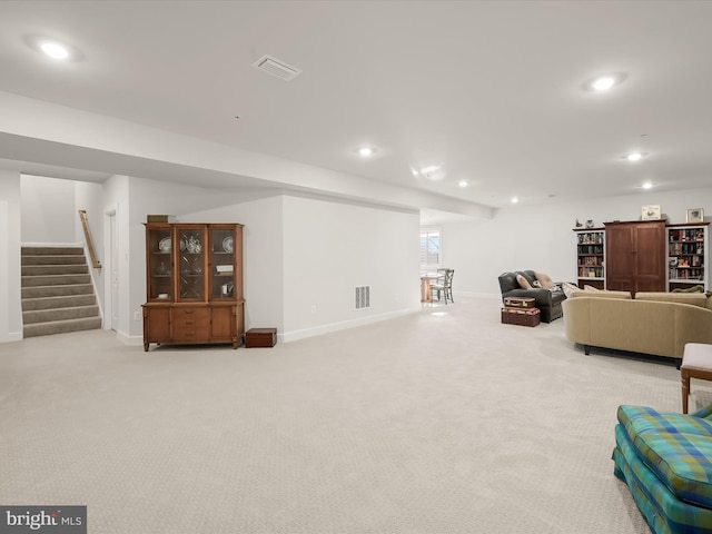 living room featuring light carpet