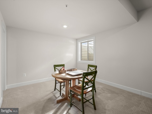 dining area with light carpet