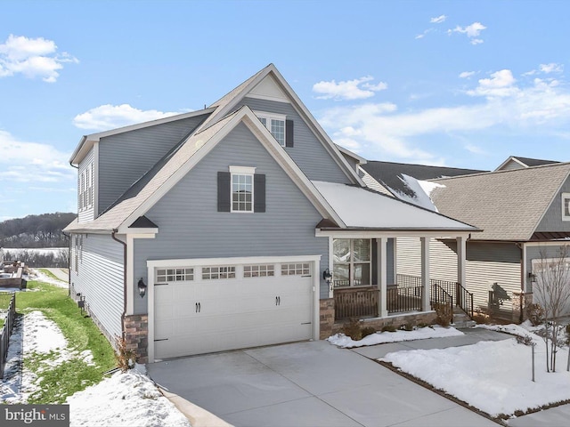 view of front of property featuring a garage and covered porch