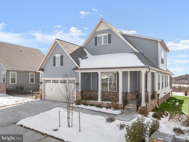 view of front of house with a garage and a porch