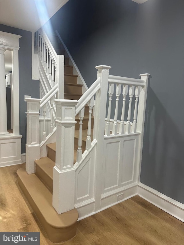 staircase featuring hardwood / wood-style floors