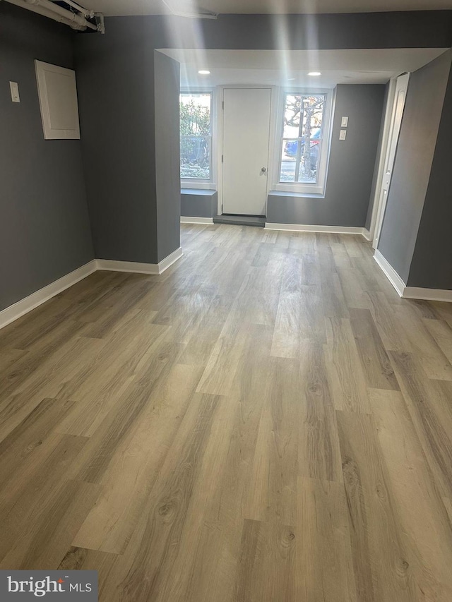 unfurnished room featuring light hardwood / wood-style floors