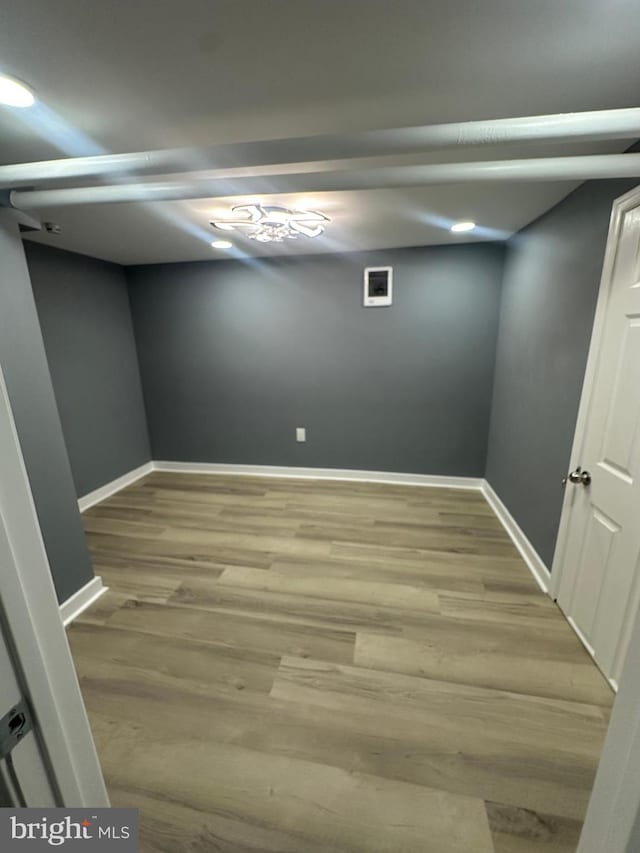 basement featuring light wood-type flooring