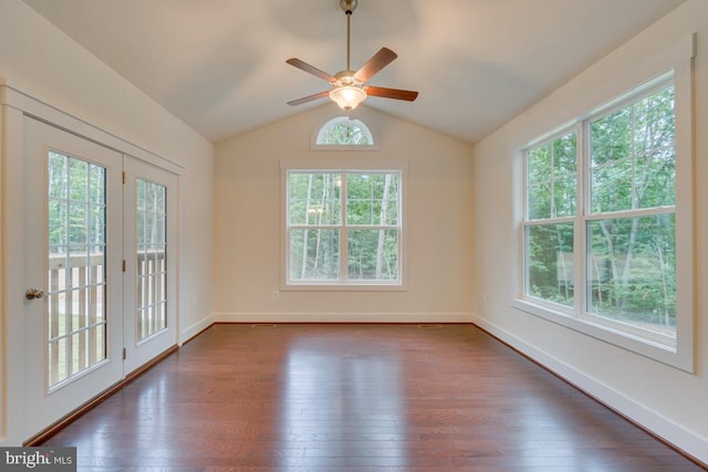 spare room with dark wood-type flooring, ceiling fan, lofted ceiling, and french doors