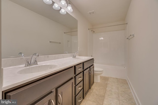 full bathroom featuring toilet, vanity, and  shower combination