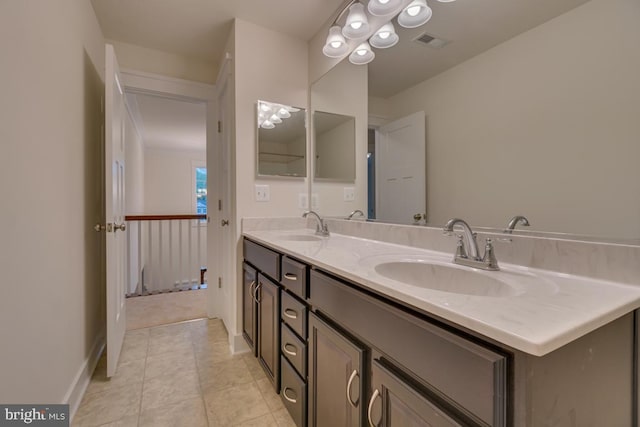 bathroom with vanity and tile patterned flooring