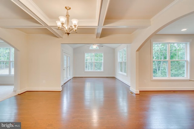 interior space featuring ornamental molding, ceiling fan with notable chandelier, hardwood / wood-style floors, and beamed ceiling