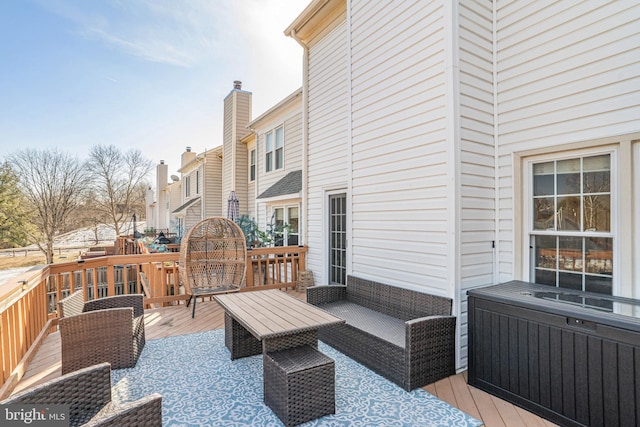 deck with an outdoor hangout area and radiator heating unit