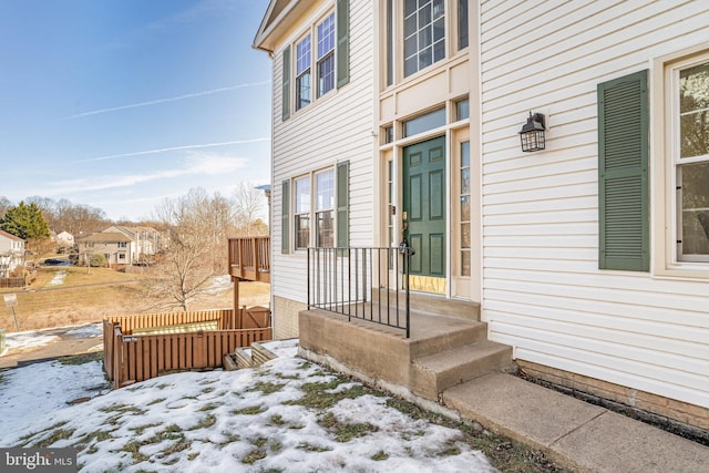 view of snow covered property entrance