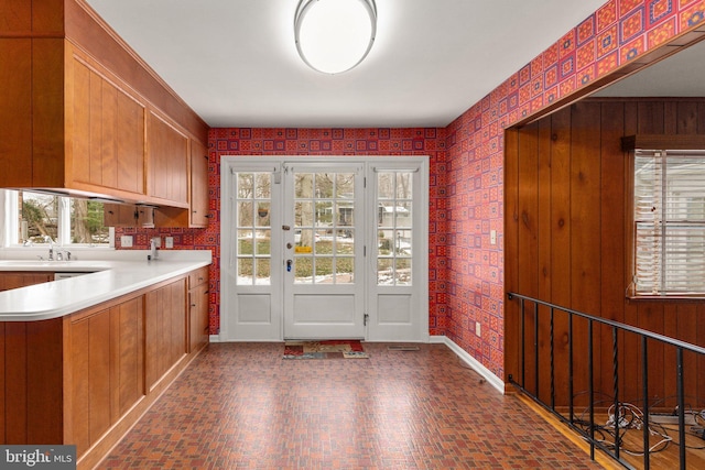 doorway featuring a healthy amount of sunlight and sink