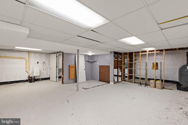 basement featuring a paneled ceiling