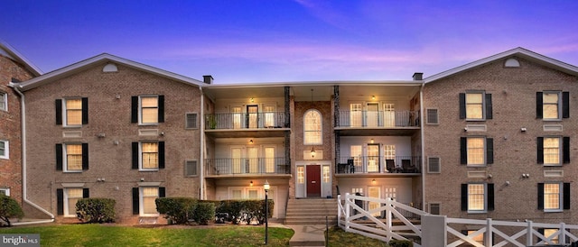 view of outdoor building at dusk